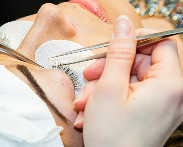 Applying shop eyelash extensions